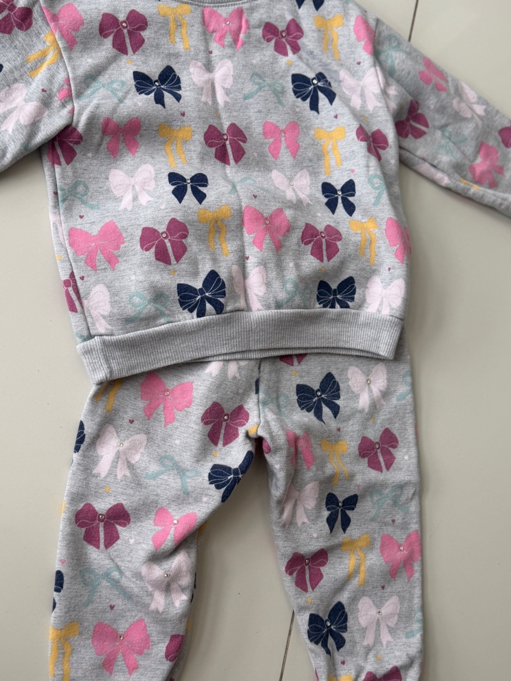 Unique outfit with embellishments on bows with genuine crystals